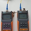 Optical Power meter and optical light source. These are used to test the loss of an optical link